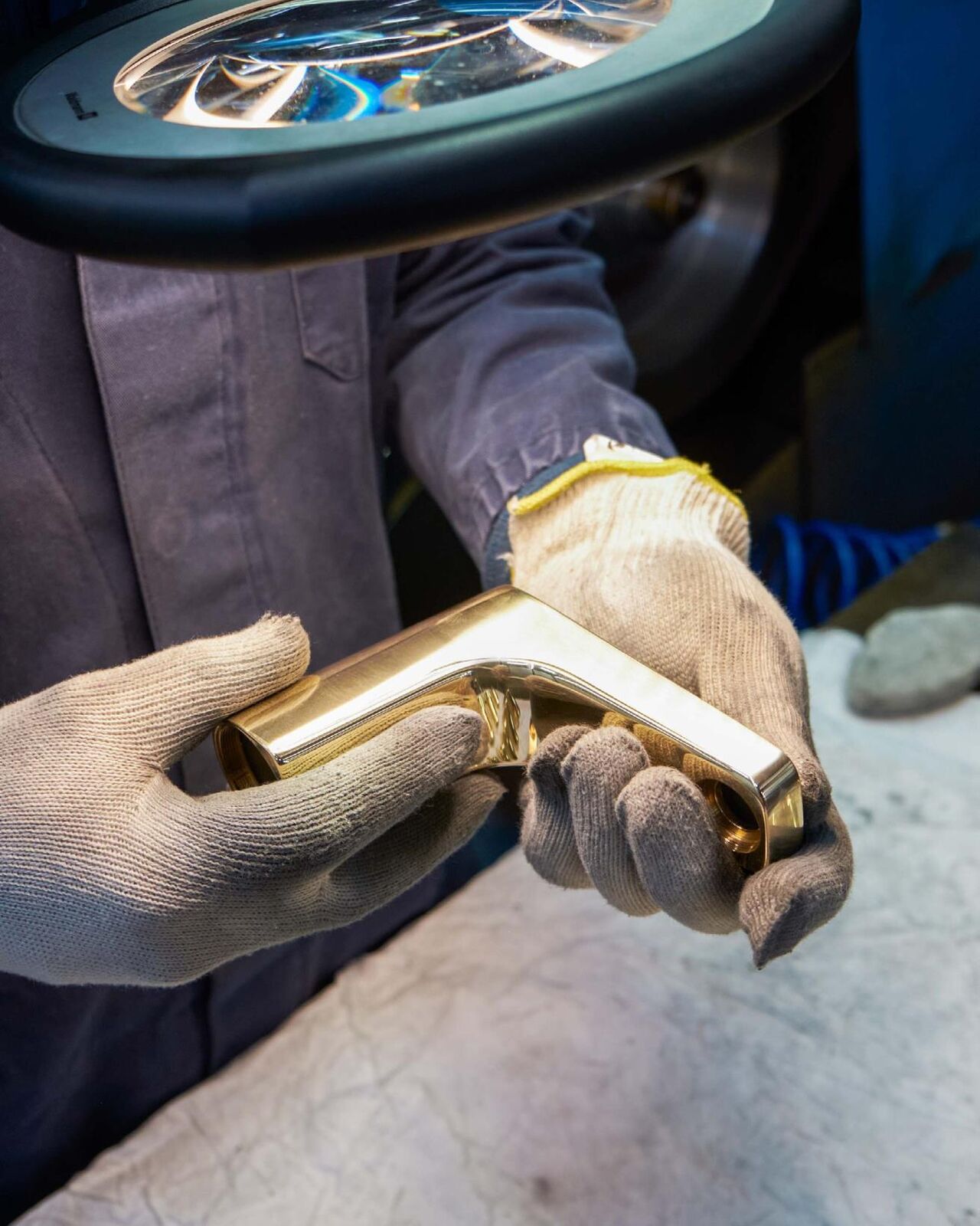 Brassware being hand-finished in the Zucchetti workshop